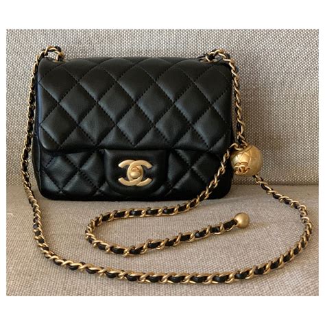 small black chanel purse with pearls